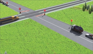 Přejezd železnice s dvoustupňovým zabezpečovacím zařízením – první je světelná signalizace a druhé jsou závory, přitom mezi nimi je na silnici vytvořeno zádržné bezpečnostní pásmo