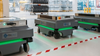 Hlavním úkolem robotů je převážet otevírací dvířka určená do sušiček Hlavním úkolem robotů je převážet otevírací dvířka určená do sušiček
